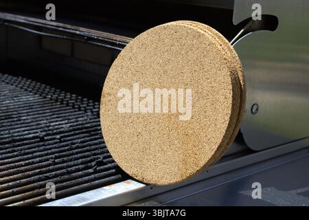 pile of cork trivets on grill Stock Photo