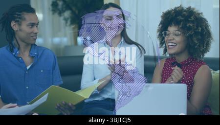 Collaborating team holding yellow folder papers, typing on laptop in lounge with globe overlay Stock Photo