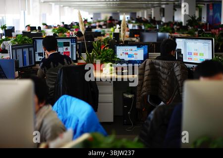 Zhejiang Hangzhou Alibaba Software Company Open-Plan Office, Programmers at Multi-Screen Workstations, China Stock Photo
