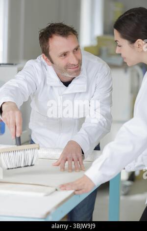portrait of tutor and students on decorating course Stock Photo