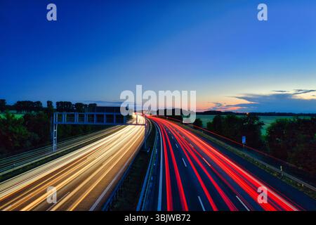 German Autobahn at Morning Speed ​​Traffic Light Trails  Motorway Long Exposure  Car Sunset Vacatio Trip Sunrise Highway Street Asphalt Stock Photo
