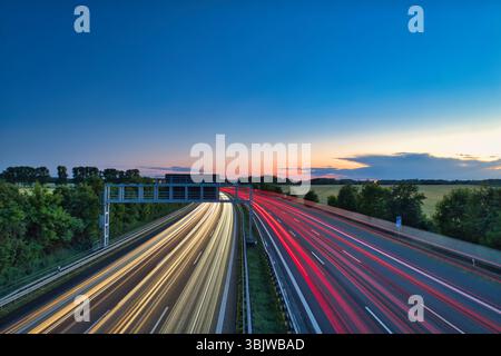 German Autobahn at Morning Speed ​​Traffic Light Trails  Motorway Long Exposure  Car Sunset Vacatio Trip Sunrise Highway Street Asphalt Stock Photo
