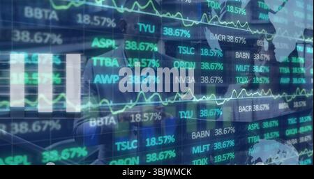 Financial analysts analyzing stock data in office, with charts and tickers on transparent screen Stock Photo