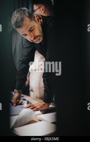 Focused professional analyzing documents during a business meeting Stock Photo
