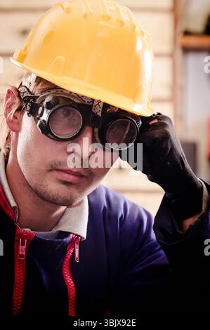 Hard working man in helmet Stock Photo