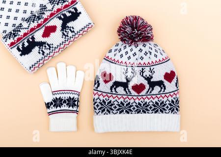 Gloves and worm woolen hat. winter set on orange background Stock Photo