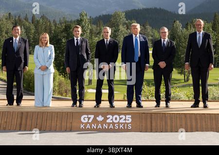 Prime Minister Mark Carney, left, speaks to Rheal Siuret and learns