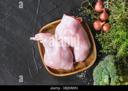 Raw rabbit legs with vegetables Stock Photo