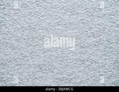 A dimpled white structure. Background of foamed polyethylene. Stock Photo