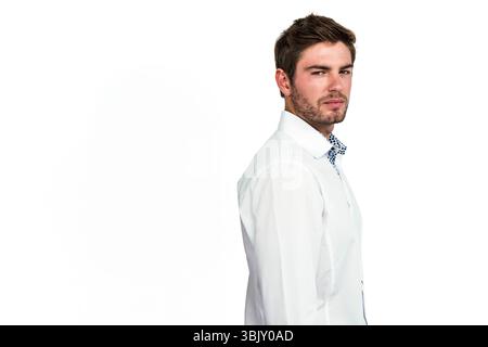 Adult man wearing white shirt in three-quarter profile against white backdrop showing collar detail Stock Photo