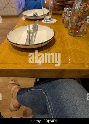 Quiet moments, simple settings, and warm tones. A table set for soft conversations and slow sips — where time gently fades into comfort. Stock Photo