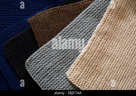 Mix of black, gray, blue Indigo, brown and beige knitted wool texture background pattern horizontal background. Selective focus. Stock Photo