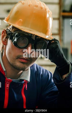 Hard working man in helmet Stock Photo