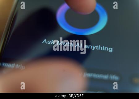 Close-up of smartphone screen with Meta AI assistant interface and search suggestions displayed. June 17, 2025 Stock Photo