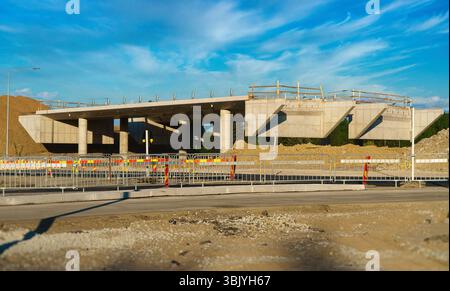 Viaduct bridge under construction. Construction of a multi-level road junction. Stock Photo