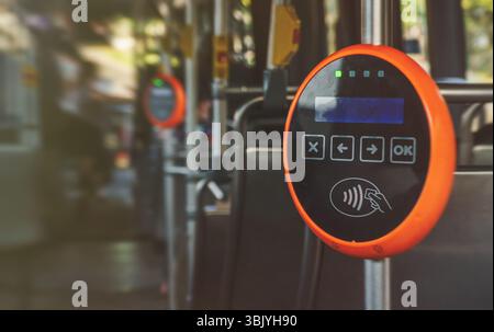 Ticket validation system on modern public transport Stock Photo - Alamy
