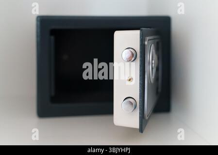 Black small home or hotel safe with keypad. Stock Photo