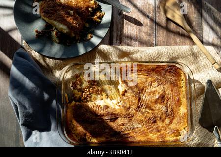 Homemade classic shepherd's pie with creamy mashed potatoes and savory meat filling garnished with herbs and vegetables Stock Photo