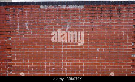 SHEFFIELD, UK - JUNE 13, 2025 - Commemorative bricks forming a wall in Sheffield, UK, creating a lasting tribute Stock Photo