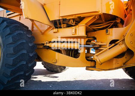 Frontal bulldozer loader. Yellow excavator close up. Stock Photo