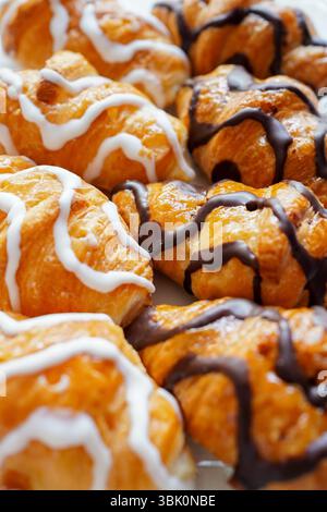 Freshly made white and black chocolate mini croissants on the breakfast table Stock Photo