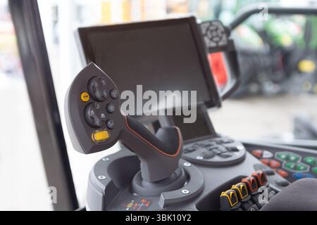 The cabin and control stick tractor of a modern tractor close-up. Industry Stock Photo