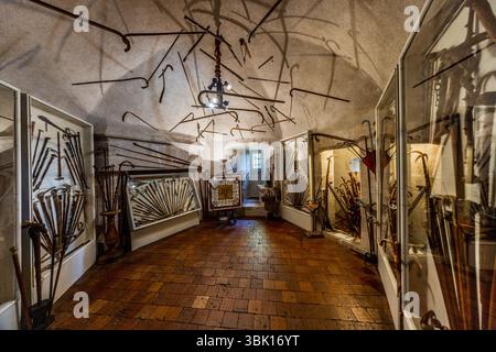 The Château de Boussac in Creuse is a medieval fortress with a rich history. Since the 1960s, collectors Lucien Blondeau and Bernadette Bondeau have furnished the château with numerous tapestries and all kinds of antiques and collectibles. Here is an entire room filled with walking sticks. Rue de la Cure, Boussac, Nouvelle-Aquitaine, France Stock Photo