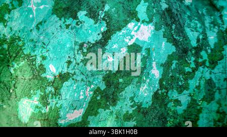 Grungy Teal and Green Peeling Paint Wall Texture Stock Photo