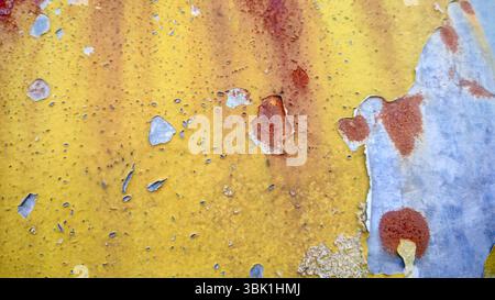 Extreme Peeling Paint and Rust on Yellow Concrete Stock Photo