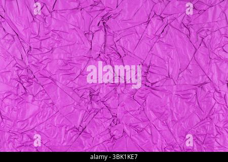 Purple color crumpled paper texture as background. Stock Photo