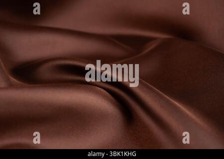 Dark brown color silk texture, Abstract as background. Stock Photo