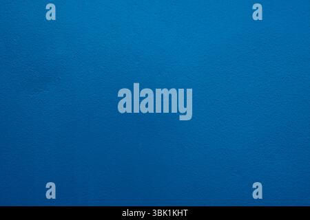 Concrete wall deep blue color for background. old grunge textures with scratches and cracks. Stock Photo