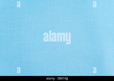Industrial style light blue cotton fabric texture useful as a background. Stock Photo