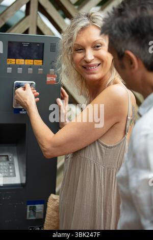 older couple using a parking machine Stock Photo