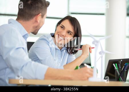 two architects making models in office using digital tablet Stock Photo