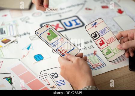 Designers Discussing User Interface Prototypes and Feedback Stock Photo