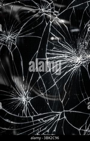 Smartphone with dark broken screen closeup photo Stock Photo