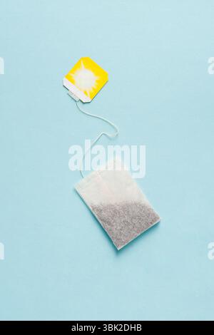 Top view of tea bag on blue background Stock Photo