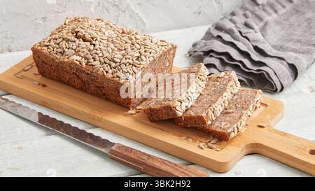 Rustic rye bread on a wooden board – traditional whole grain loaf, perfect for breakfast, food styling, baking scenes Stock Photo