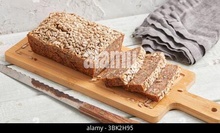 Rustic rye bread on a wooden board – traditional whole grain loaf, perfect for breakfast, food styling, baking scenes Stock Photo