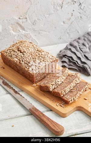Rustic rye bread on a wooden board – traditional whole grain loaf, perfect for breakfast, food styling, baking scenes Stock Photo