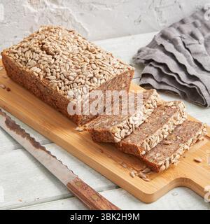 Rustic rye bread on a wooden board – traditional whole grain loaf, perfect for breakfast, food styling, baking scenes Stock Photo