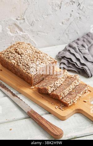 Rustic rye bread on a wooden board – traditional whole grain loaf, perfect for breakfast, food styling, baking scenes Stock Photo