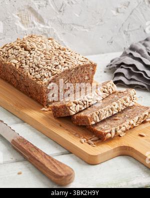 Rustic rye bread on a wooden board – traditional whole grain loaf, perfect for breakfast, food styling, baking scenes Stock Photo