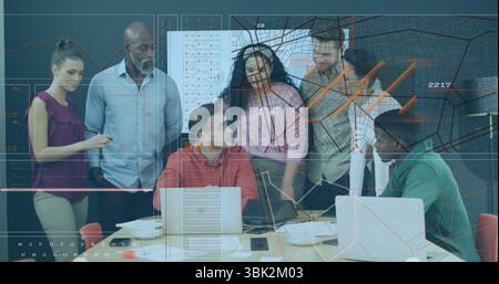 6 professionals analyzing financial charts on laptops in meeting room with documents coffee mugs Stock Photo
