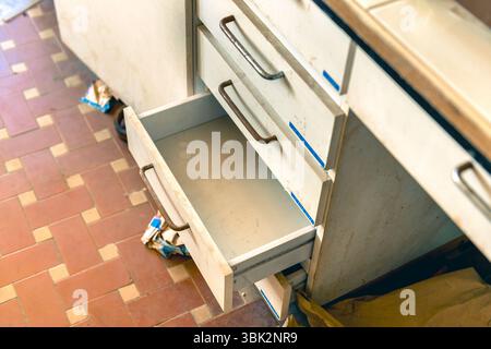 Cupboard with opened empty drawer closeup photo Stock Photo