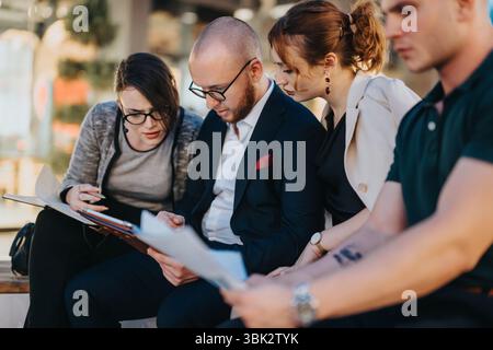 Group of diverse entrepreneurs collaborating and strategizing in an informal meeting setting Stock Photo
