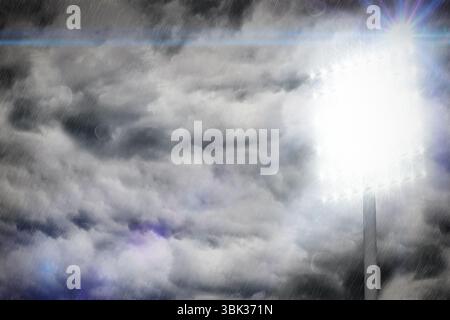 Floodlight tower is piercing storm clouds in vector illustration showing lens flares, rain streaks Stock Photo