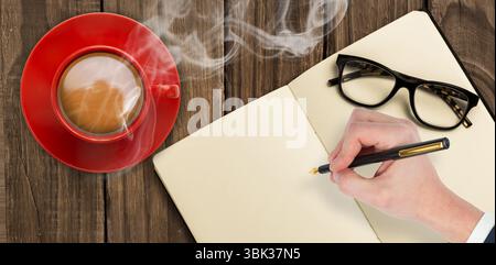 Flat design right hand is poising pen over notebook on table with red coffee cup, glasses Stock Photo