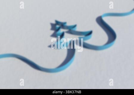 Flat design blue ribbon strip is winding across white textured surface, forming stylized tree shape Stock Photo